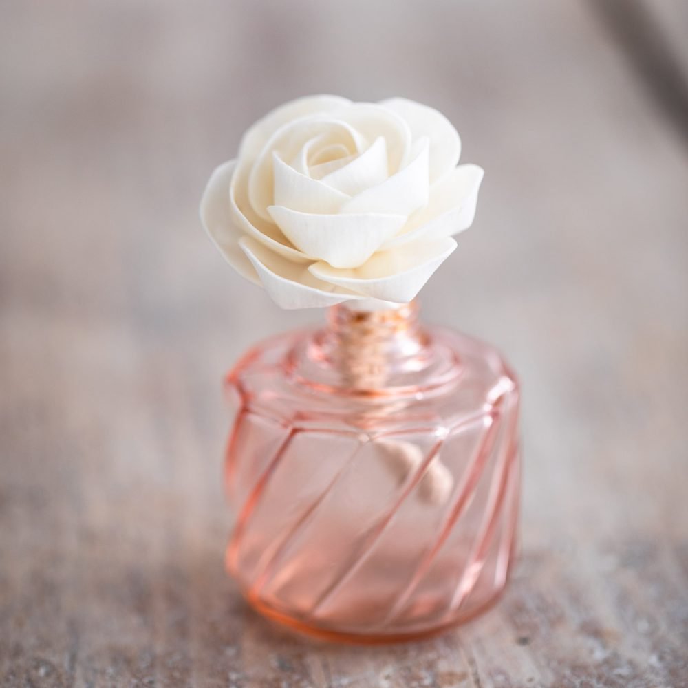 Tiny Camellia Diffuser Flower in a pink bottle