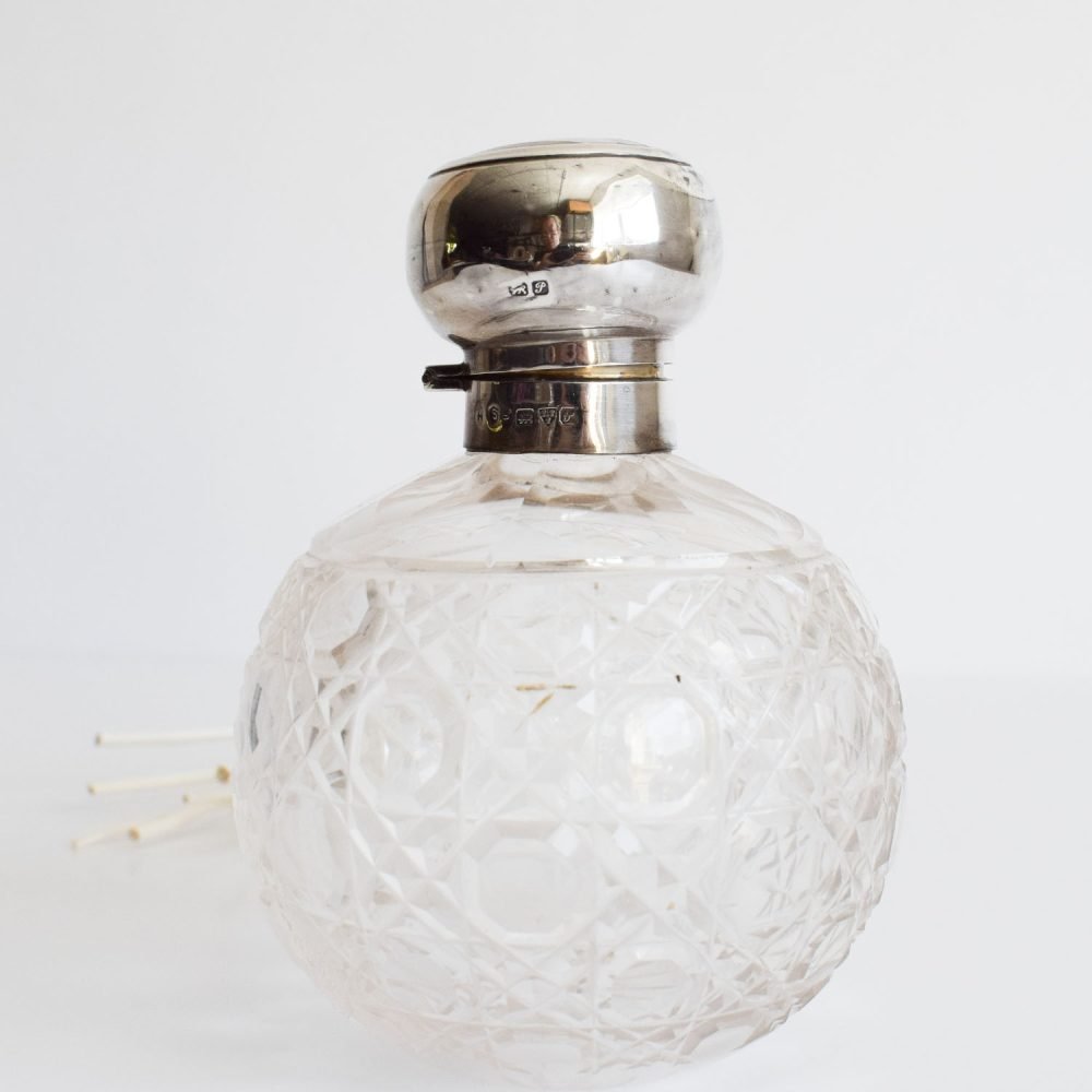 Edwardian cut glass diffuser with an original hallmarked silver top