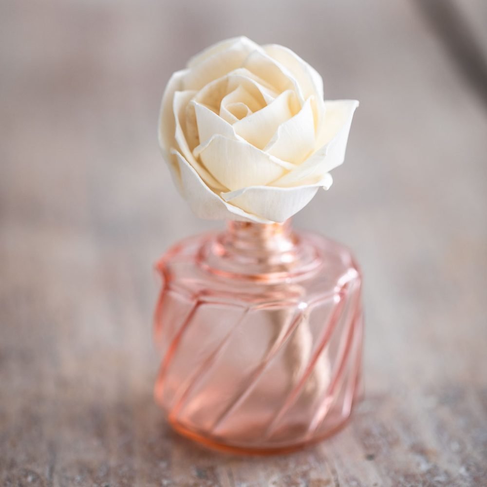 Small diffuser flower rose in pink bottle
